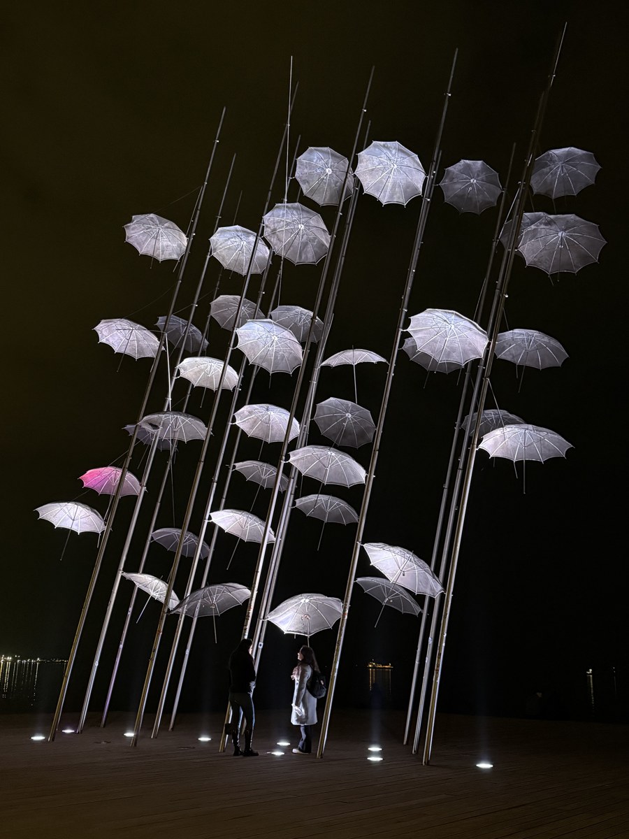 The illuminated umbrellas sculpture on the Thessaloniki waterfront at night